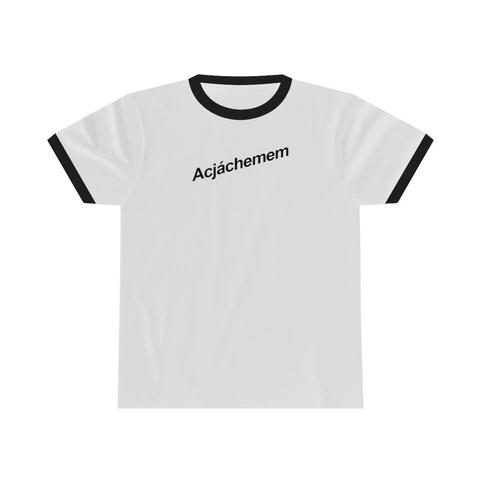 White ringer Tshirt, black colar and cuffs, on flat surface. Slanted font in black across the chest reads: Acjáchemem (Jueneño)