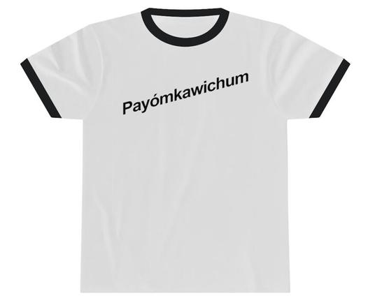 White ringer Tshirt, black colar and cuffs, on flat surface. Slanted font in black across the chest reads: Payómkawichum (Luiseño)