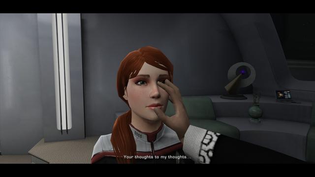 A woman with red hair, tied in a pony-tail slung over her shoulder and wearing a futuristic Starfleet uniform, has a Vulcan place his fingers directly into her eyeball to perform a mind-meld