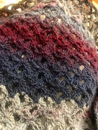 Crochet scarf.  Vintage peach stitch. Looks a bit like little half’s of little peaches put together.  Grey,blue,pink and purple colours. Wool and acrylic.