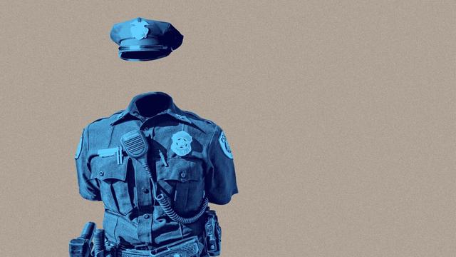 An empty police uniform as if worn by an invisible mannequin