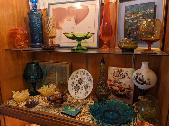 Glassware in striking color and art evoking an early 20th century style