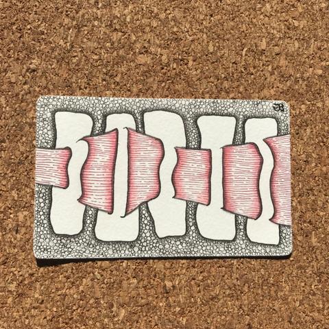 Zentangle Phi paper tile with black ink, and shaded with graphite and red pastel chalk