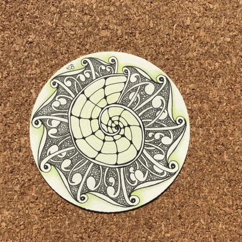 Zentangle zendala paper tile with black ink, graphite hite, and yellow-green shading