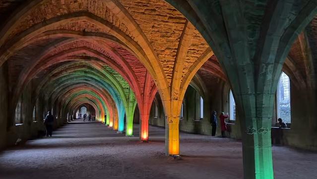 Screenshot of Fountains Abbey via a LIVE tour given by Evelyn Edwards and the Castle Crew pic3 the inside of the monastery is lit up beautifully