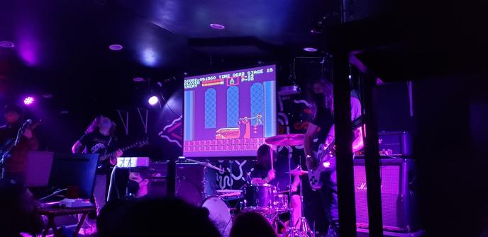 The band Bit Brigade and the player attacking the final boss.