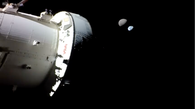 The Artemis spacecraft on the left with the Earth and the moon on the right