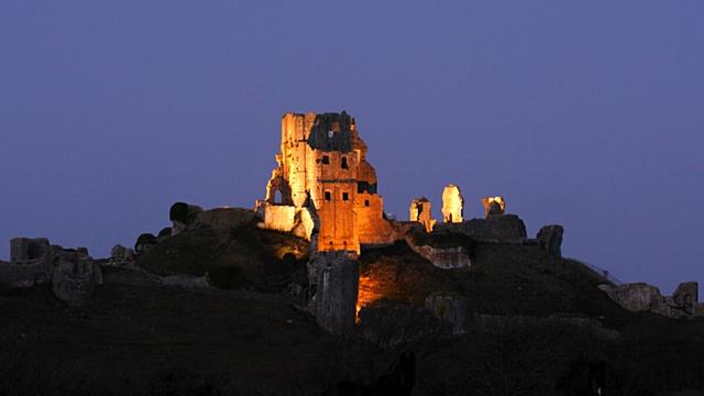Corfe Castle illuminated at night