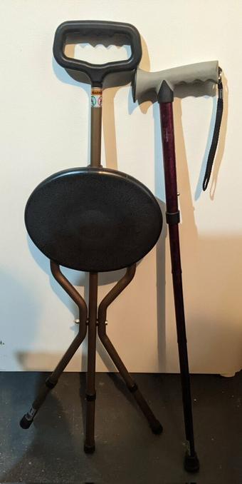 pic of stool cane and red cane mobility aids.