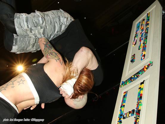 Then Interspecies Wrestling champion Addy Starr lifts famous Death Match wrestler Nick Gage in a suplex by a door covered with legos in 2019