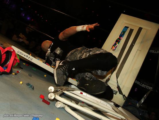 Famous Death Match wrestler Nick Gage crashes into a door covered with legos in 2019