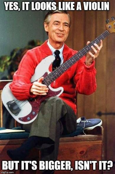 Mr Roger's holds a bass guitar.
"Yes, it looks like a violin, but it's bigger, isn't it?"