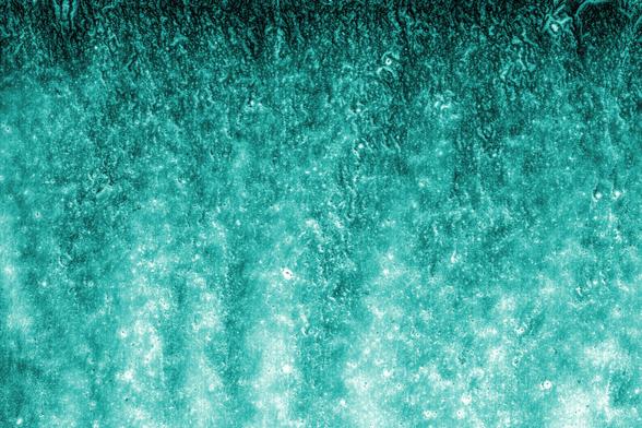 Digital photogram. Representing water, like a waterfall with green shades.