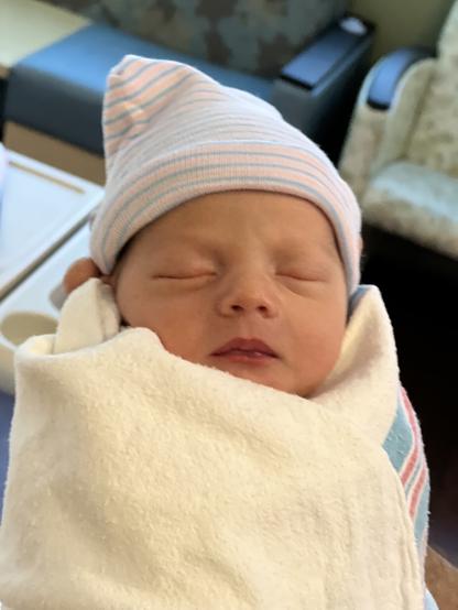 Close up shot of my beautiful one day old grandson’s beautiful sleeping face.