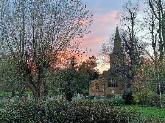 Scene showing sunset and village church taken by Linda Sgoluppi. 3 December 2022