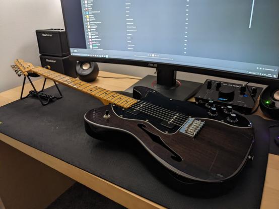 Fender Telecaster electric guitar laying on a desk