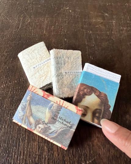 4 miniature art books about archangels. Two of them are on Saint Gabriel, others are  about Saint Michael and Saint Raphael.