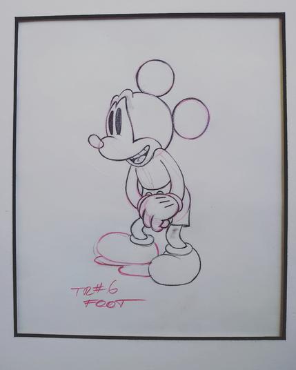 hand drawn sketch on slightly faded paper of mickey mouse done in black and red pencil. the faint working planning marks of the artist can be seen. sketch is tagged with the notes saying tr # 6 foot