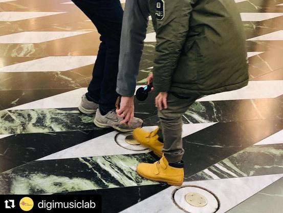 Child makes field recordings in a mall @ deeplistening workshop