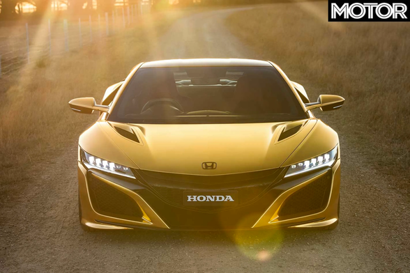 Photo of a gold-wrapped Honda NSX