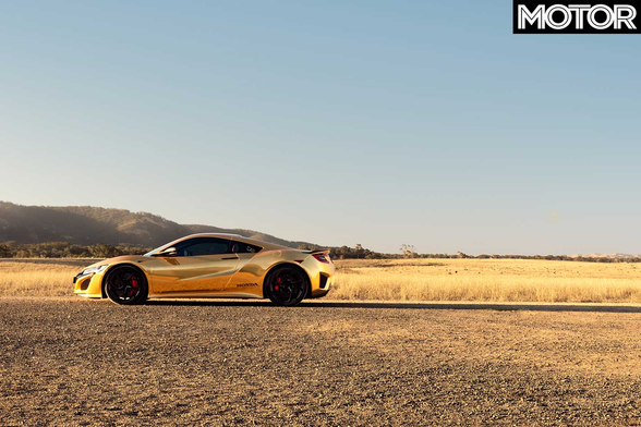 Photo of a gold-wrapped Honda NSX