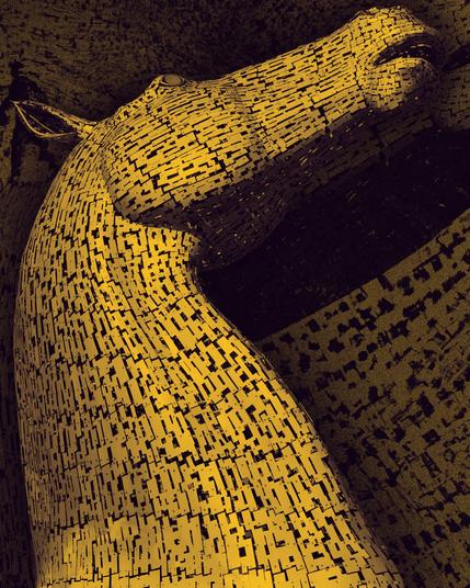 picture of a sculpture of a horse slit tones of yellow and dark purple