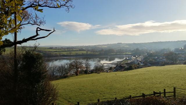 View across field to valley and river