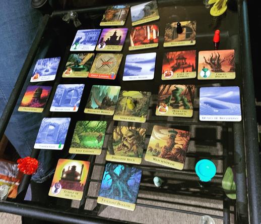 Board game Forbidden Island being played on small glass table