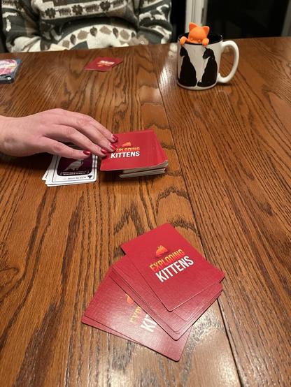 The card game exploding kittens in mid play (with the expansion packs it took 45 min before my wife and I both lost).