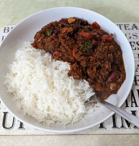 An image of a bowl of Chilli Sin Carne with steamed white rice, a.k.a. Ultimate Chilli by Bosh.