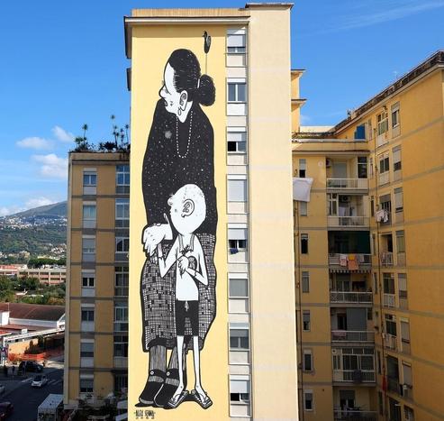 Huge Streetartwall in Black an White. Woman holding hand of child.