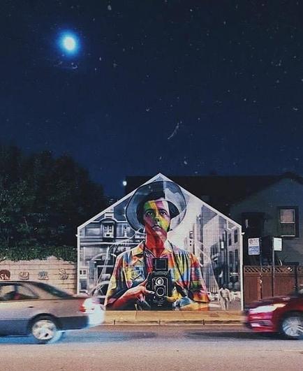 Streetartwall by Night an Snow. Painted Version of the Famous Self-Portrait of the American photographer Vivian Maier