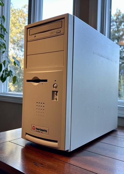 PowerComputing clone Macintosh tower sitting on a table of sorts
