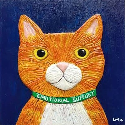 An orange cat made from clay, wearing an emotional support collar, against a dark blue background.