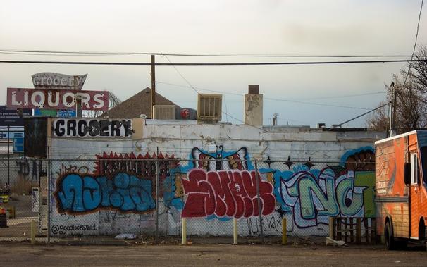 Processed photo of a graffiti-covered liquor store.