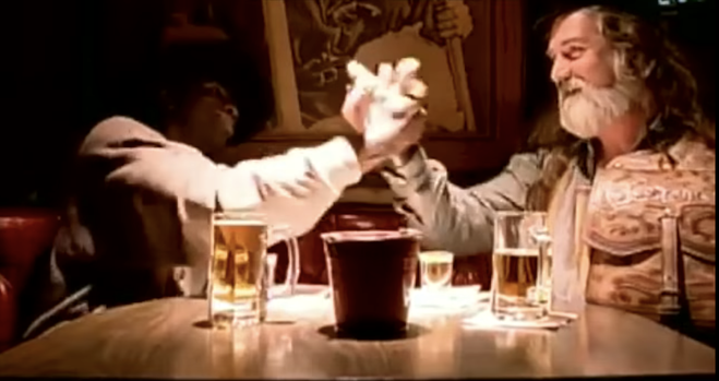 Friends holding hands in a bar