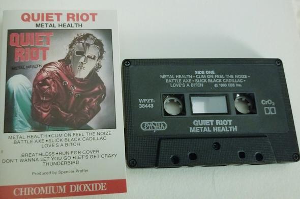 The cassette album cover for Metal Health by Quiet Riot.  With the cassette tape, side 1 facing up.