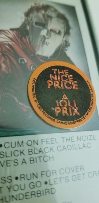 Partial cassette album cover for Metal Health by Quiet Riot - with the nice price sale sticker.  From the 80s.