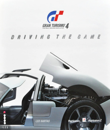 Book cover of 'Gran Turismo 4: Driving the Game' by Leo Hartas. It has a white car on the cover with the engine exposed and door open to see the racecar's interior. The Gran Turismo logo is at the top, with "Driving the Game" in silver letters below it.