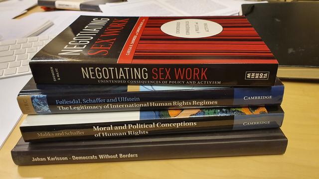 A photo of a pile of the books mentioned in the thread.
