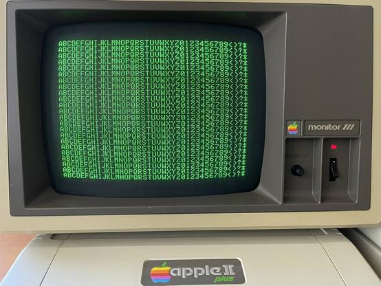 Apple Monitor /// with an Apple II Plus showing a full screen of 40 column text