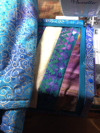 Quilted runner in colors of wine, grape, kiwi, and gold