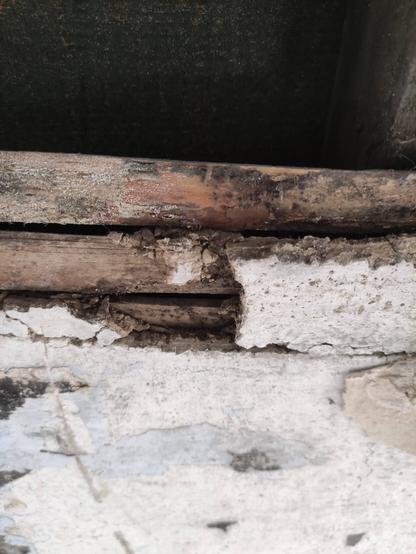 Shows old timber laths with lime stabilised clay plaster and a lime finish