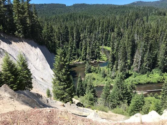 Bend in Upper Rogue River stream course and adjacent pumice exposure in eroded bank.  Color photo from 2017.