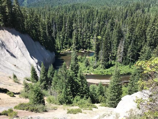 Bend in Upper Rogue River stream course and adjacent pumice exposure in eroded bank.  Color photo from 2017.