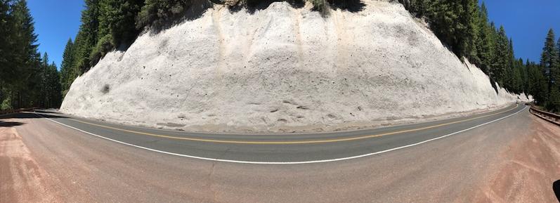 Panoramic view of the upper portion of a massive air-fall tuff deposit along Crater Lake Highway