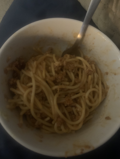A picture of spaghetti noodles with meat sauce
