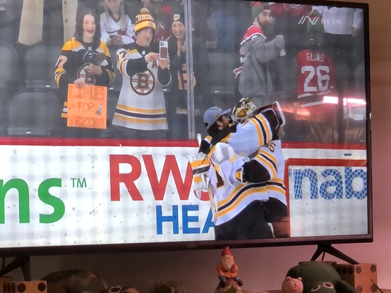Boston Bruins goalie hug