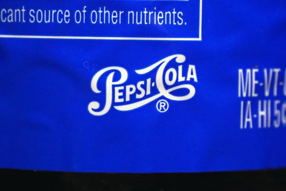 A macro shot of a Pepsi Cola Logo

Taken using a Nikkor 50mm Enlarger Lens reversed mounted with a 12 mm extension tube.  Approx a 1.24X magnification