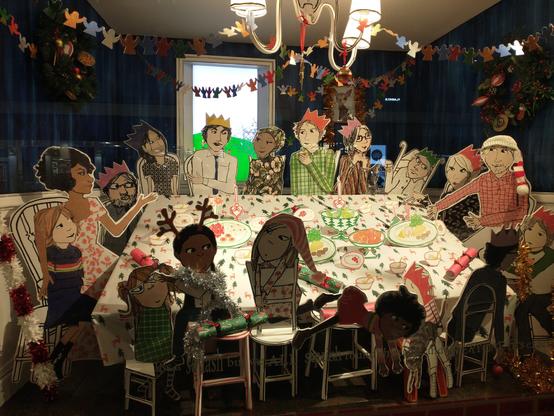 Christmas Windon decorations at Fenwick shop. Beautiful cut out cartoonish figures round a table